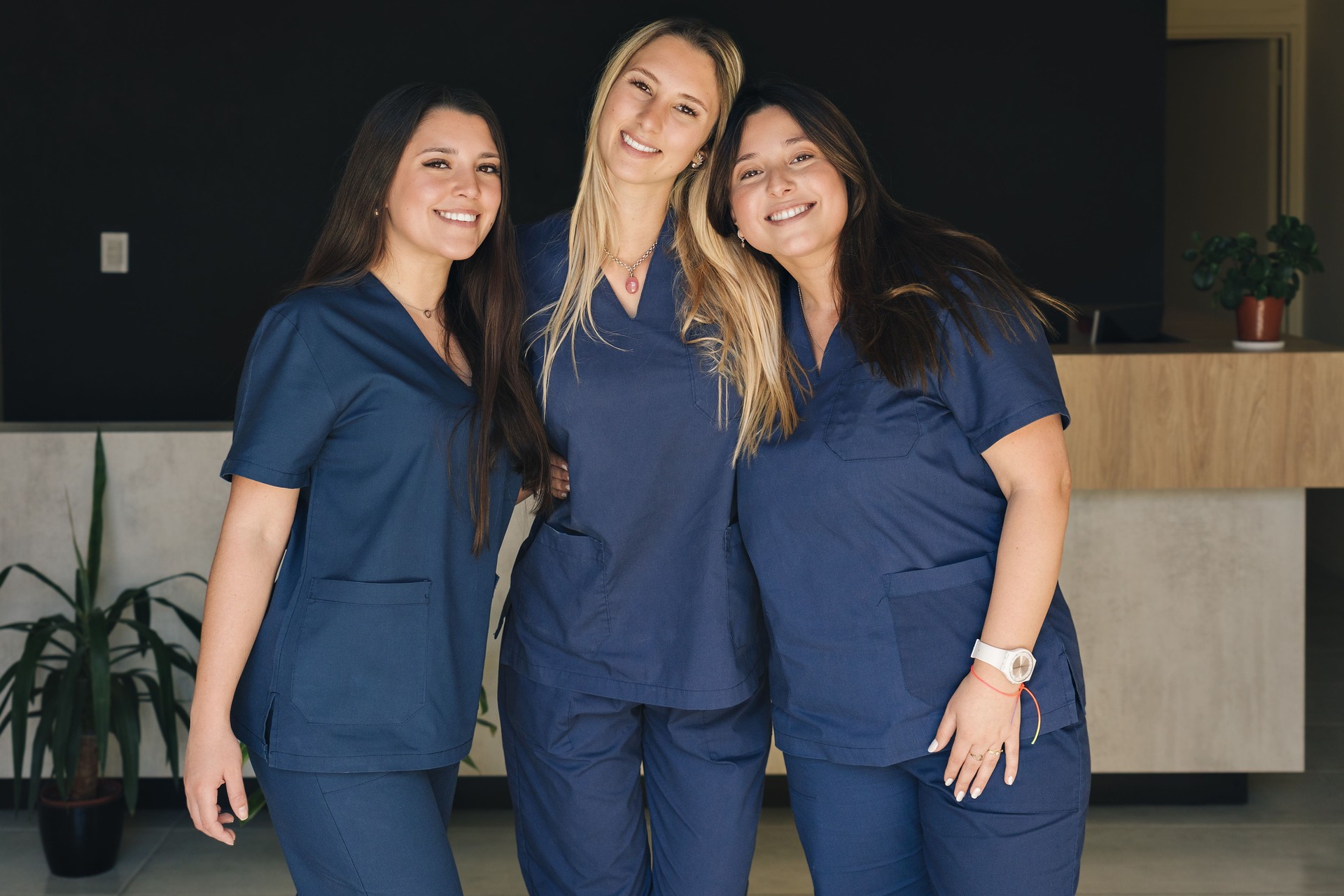 Beautiful smiling female health care workers looking at the camera.